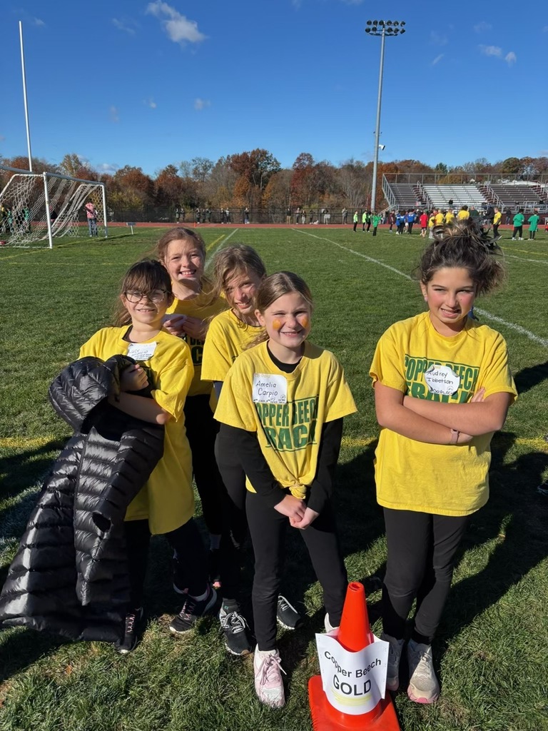 students smiling at the track meet