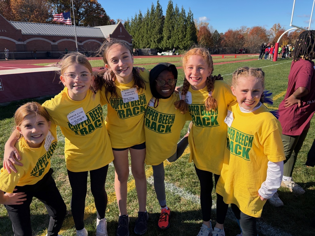 students smiling at the track meet