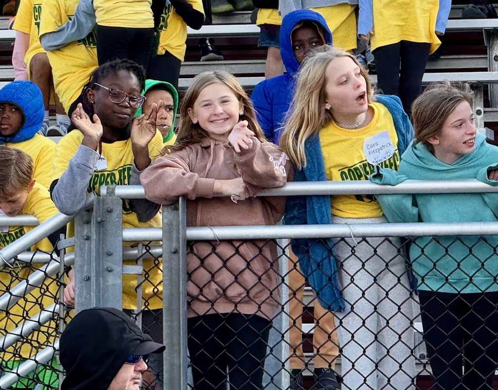 students watching the track meet