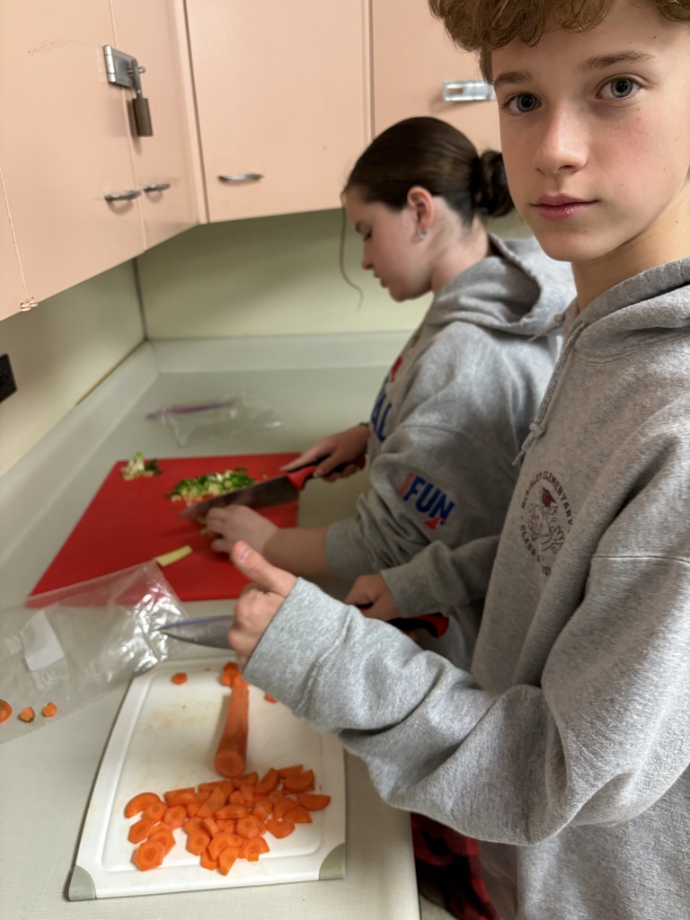 Image of 7th grade students practicing their knife skills