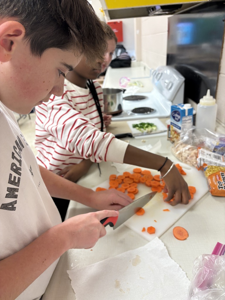 Image of 7th grade students practicing their knife skills