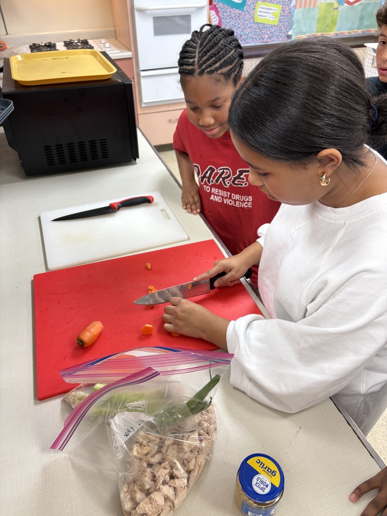 Image of 7th grade students practicing their knife skills