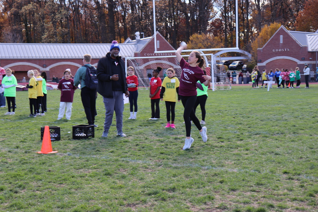 A Highland student competes in the softball throw