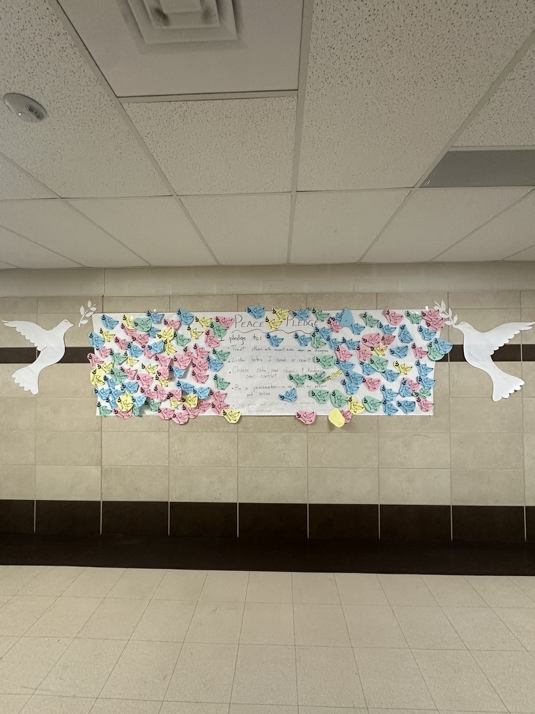 Peace Pledge with birds on both sides on the wall. 