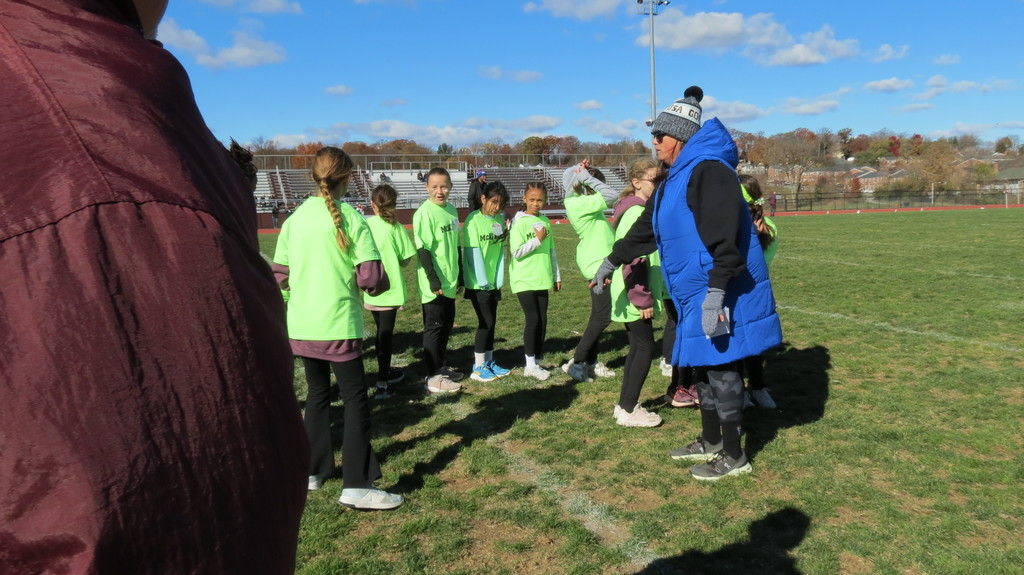 Coach Olinger giving last minute instructions to the students.