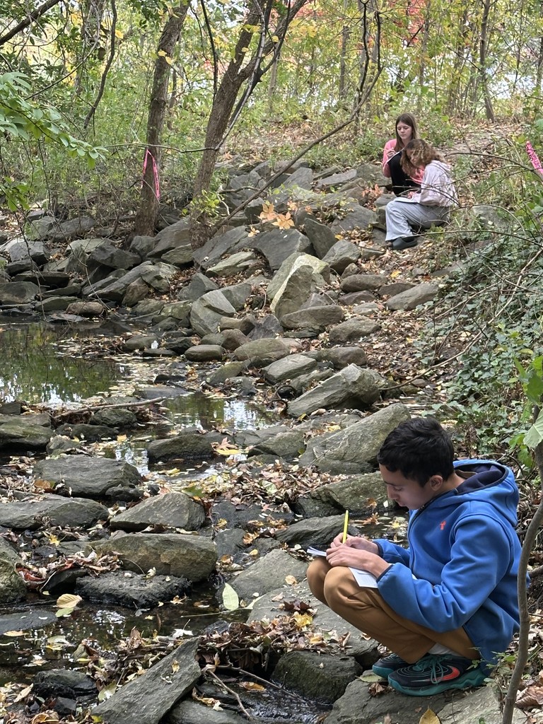 Image of Going Green Club students out in nature.