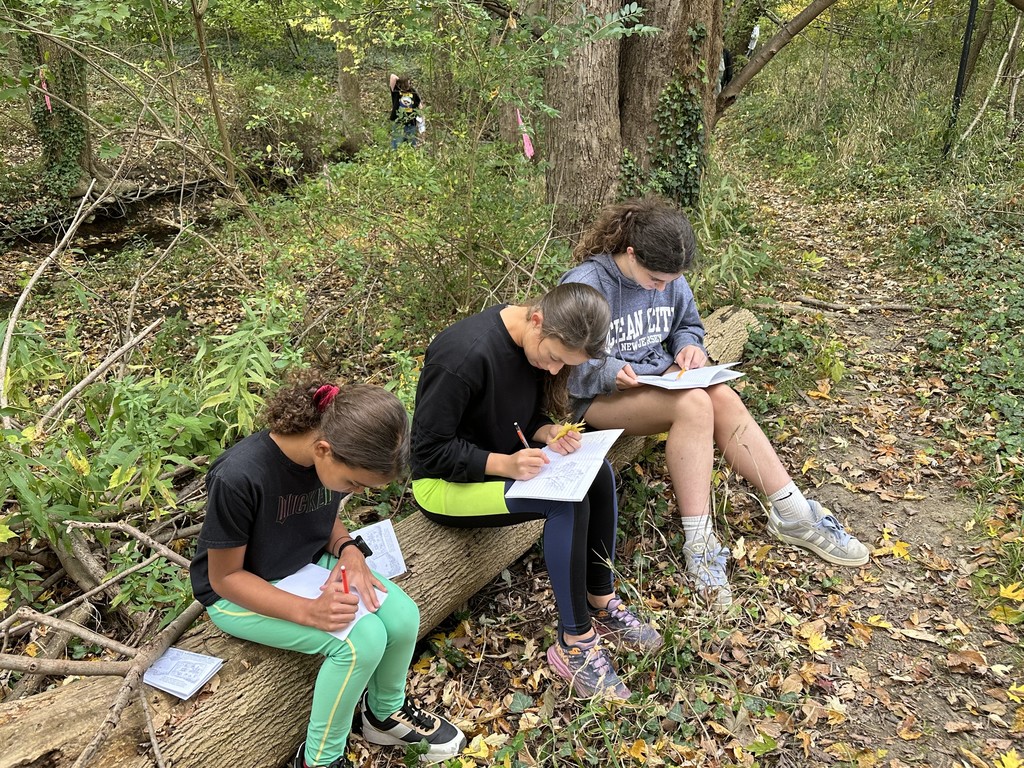 Image of Going Green Club students out in nature.