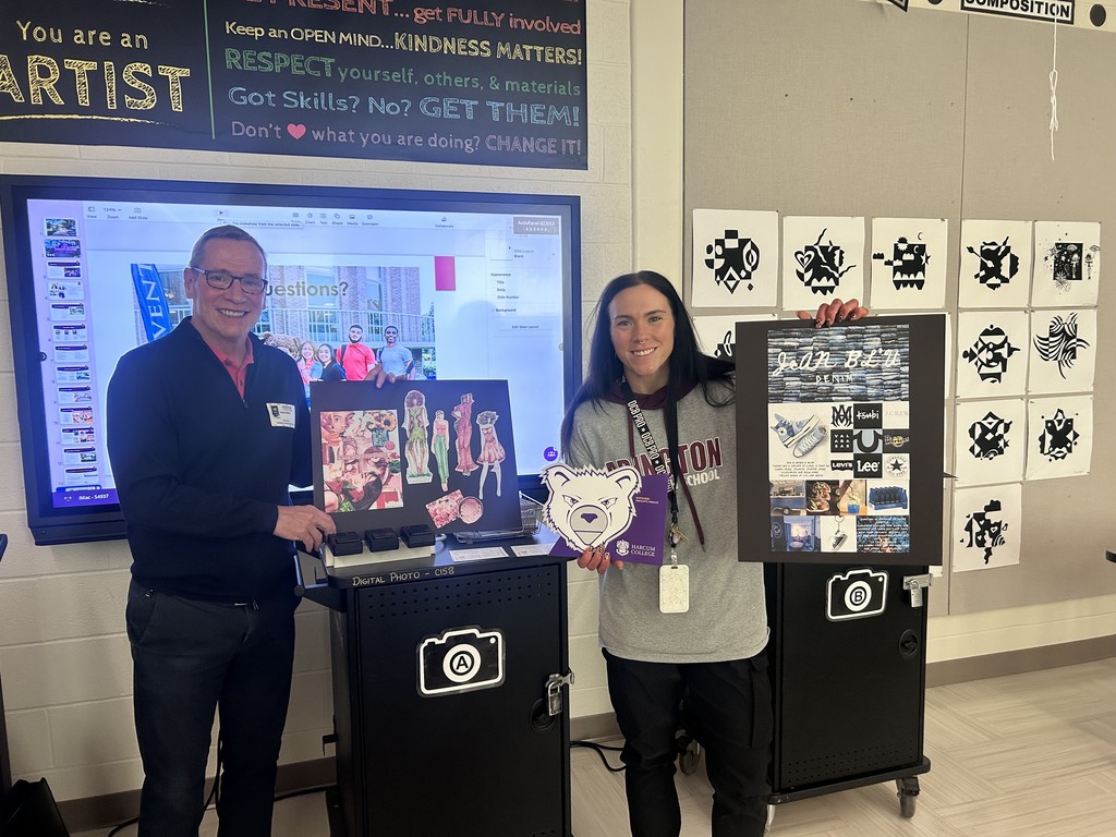 Mr. Miller and Ms. Corgan taking a photo