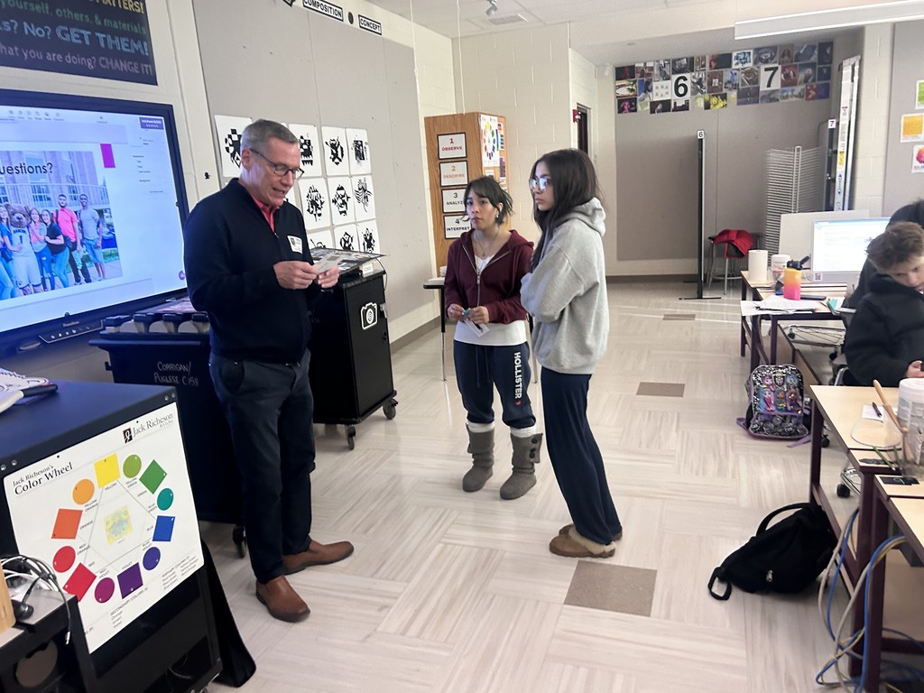 Mr. Miller speaking with students