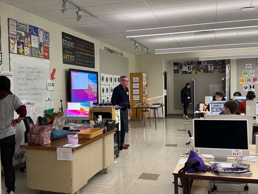 Mr. Miller speaking to the class