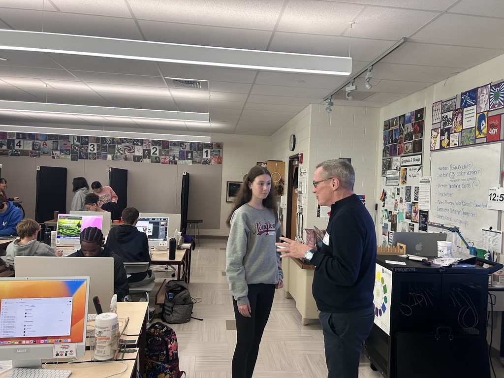 Mr. Miller speaking with students