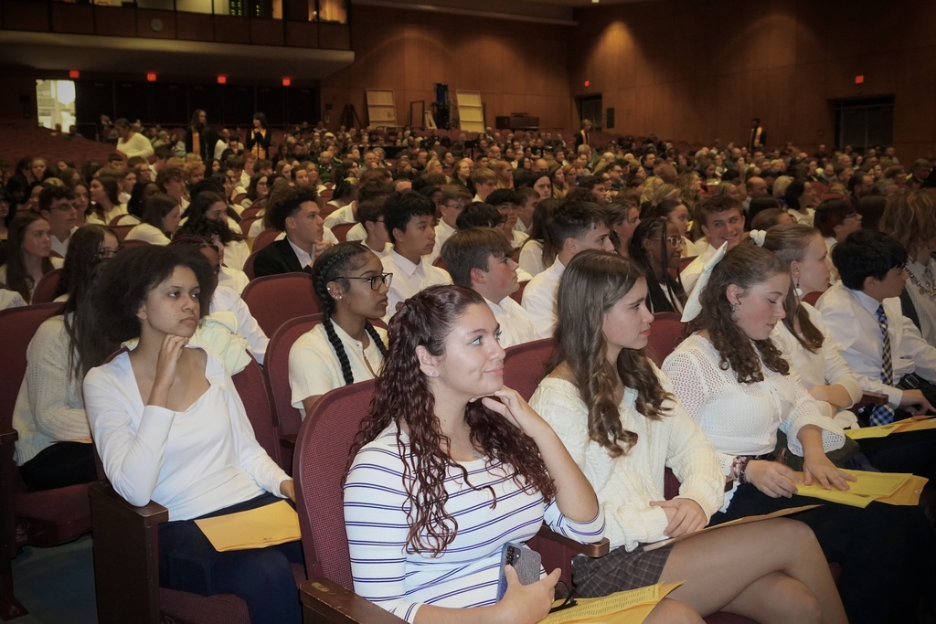 NHS inductee's listening to speakers