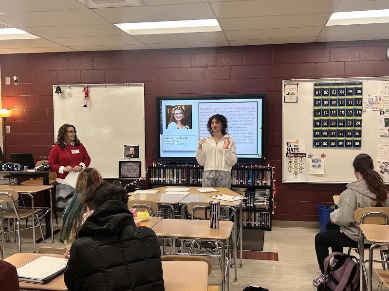 Maddie Krassner introduces Dr. Schmidt to the members of the National English Honors Society