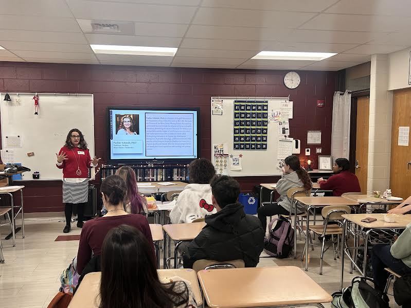 students listen to Dr. Schmidt talk