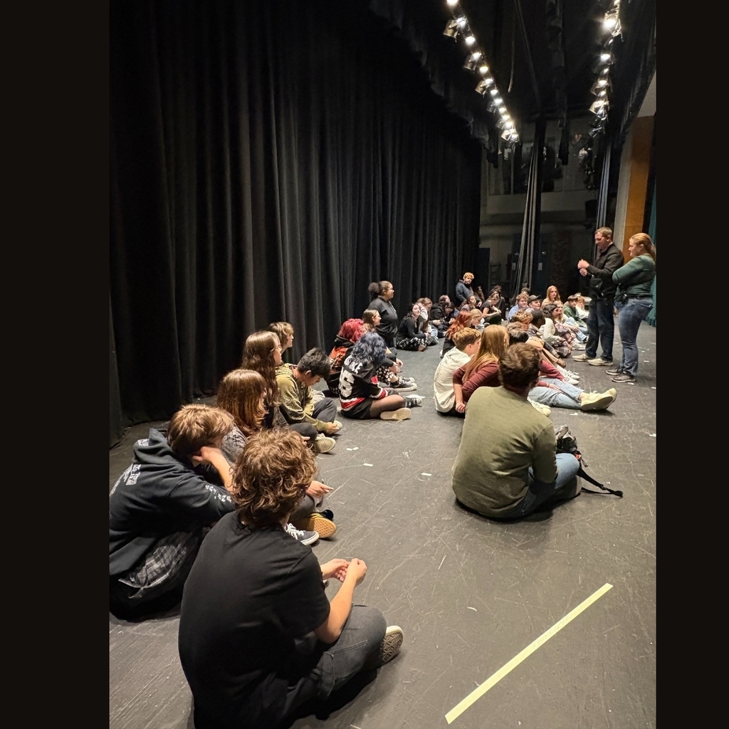 Pictures of student actors on stage listening to their director
