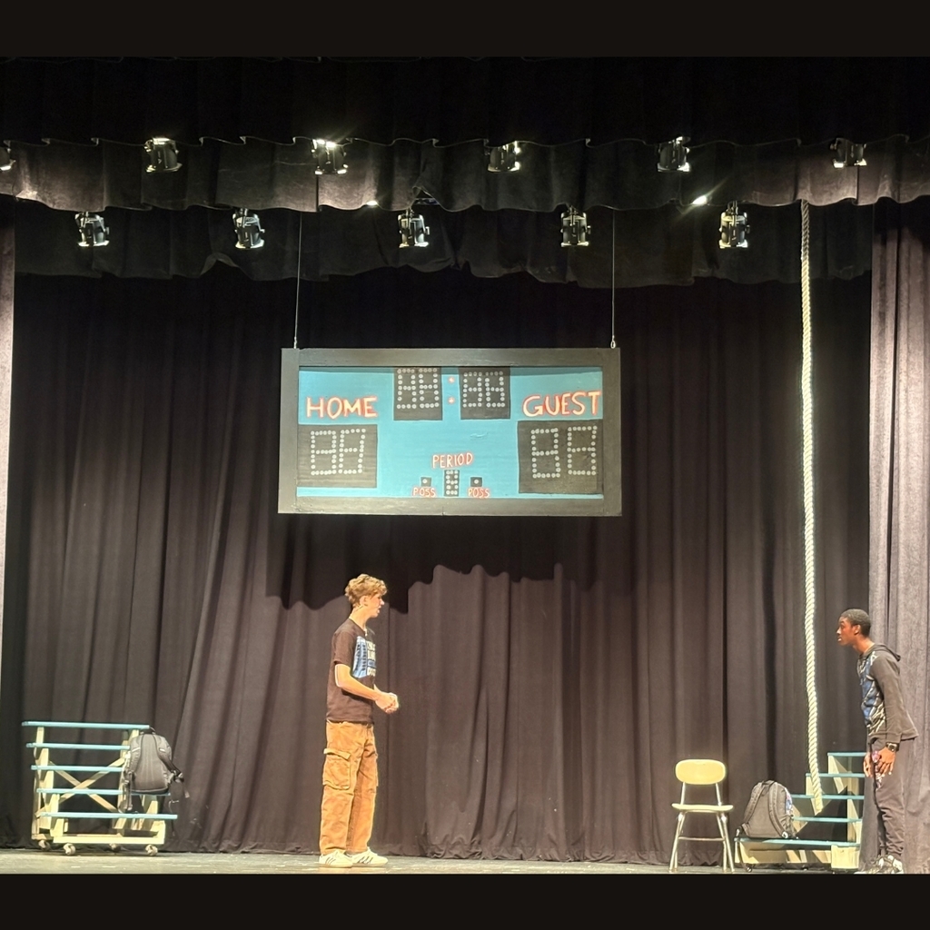 Actors on stage in the gym set