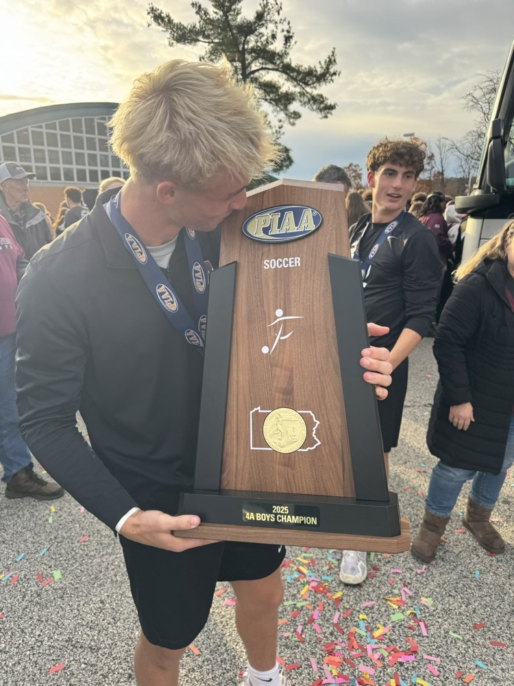 Cooper Blynt holding championship trophy 