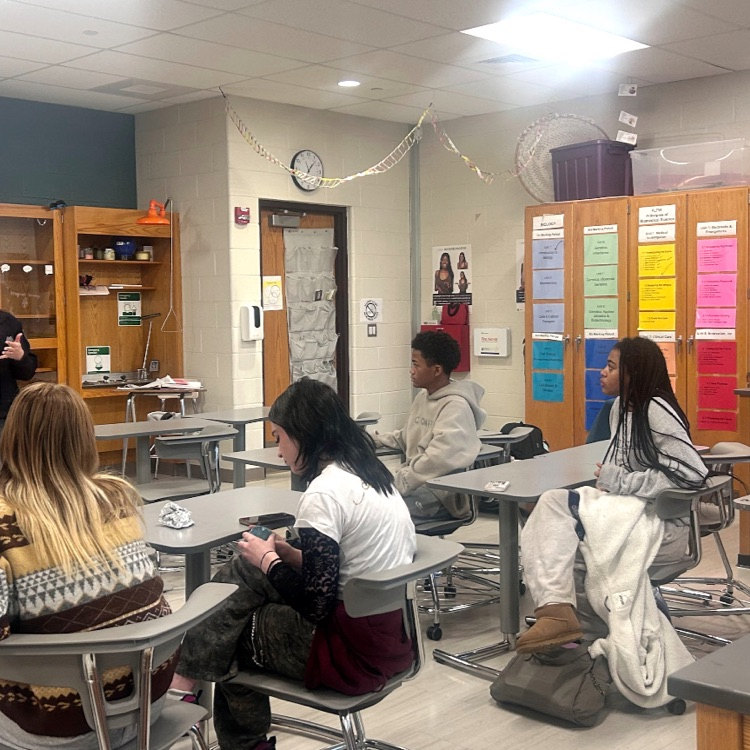 Students listening to Detective Cartwright