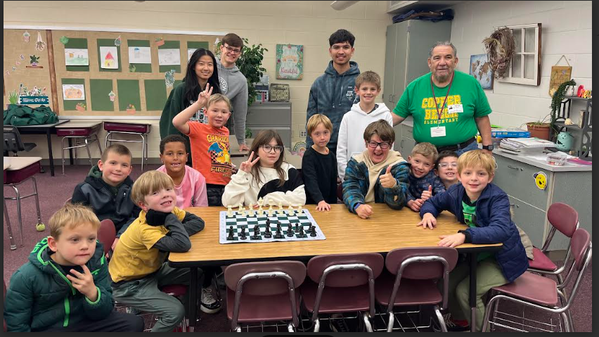 kids and chess team all together at the table