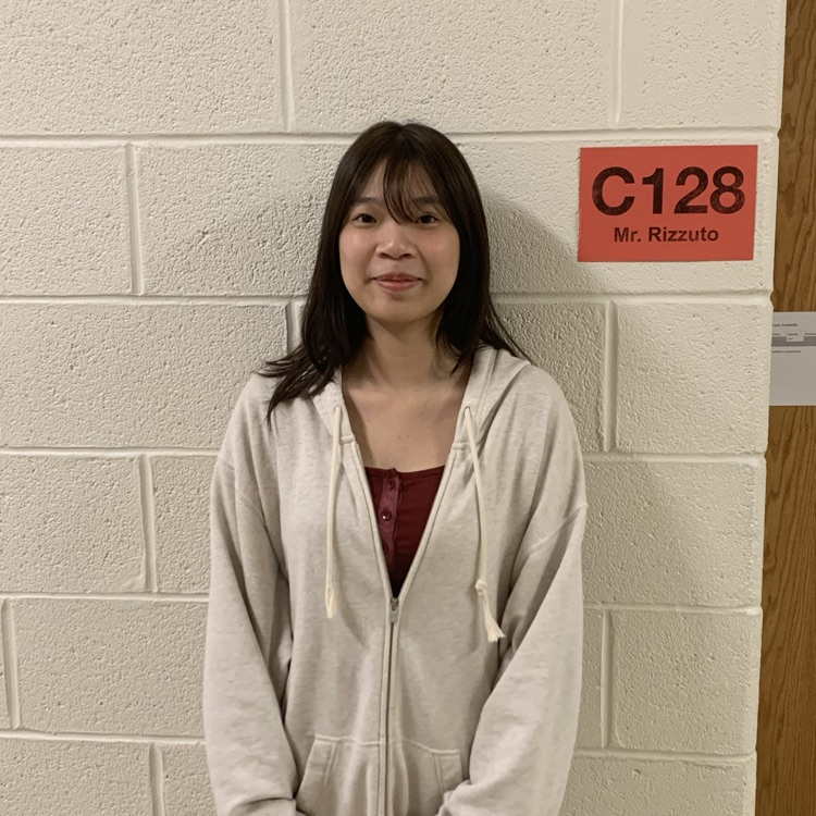 Ely Yeung standing - Winner of AMC Contest 