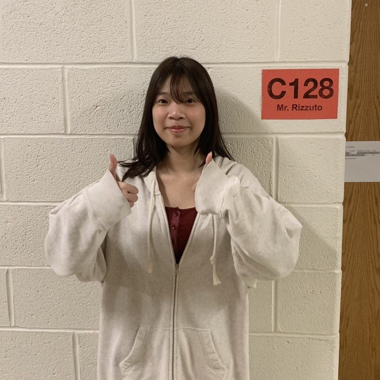 Ely Yeung standing with two thumbs up - Winner of AMC Contest 