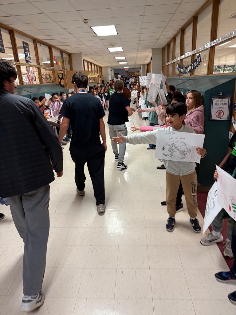 Soccer team walks through the halls of Rydal