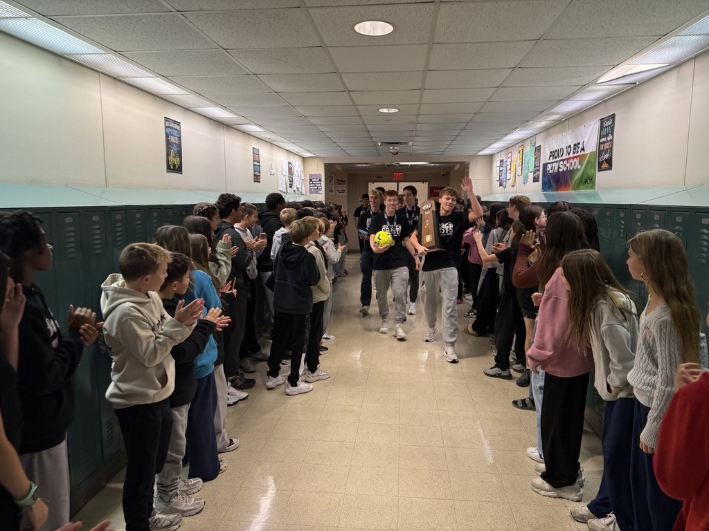 Soccer team walks through the halls of AMS