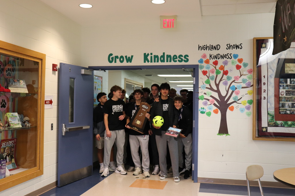 Soccer team walks through the halls of Highland