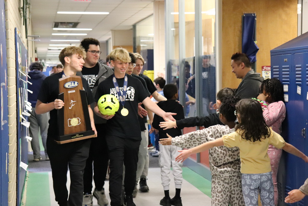Soccer team walks through the halls of McKinley