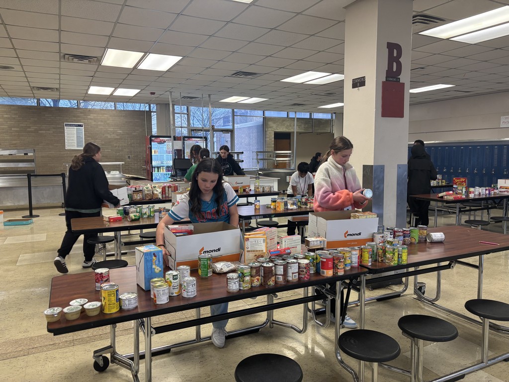 Student Council sorts food drive donations in the Commons