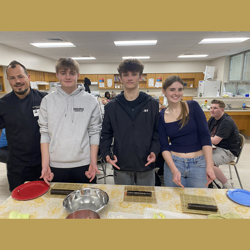 ASHS students and Chef Schindler show sushi rolled by students