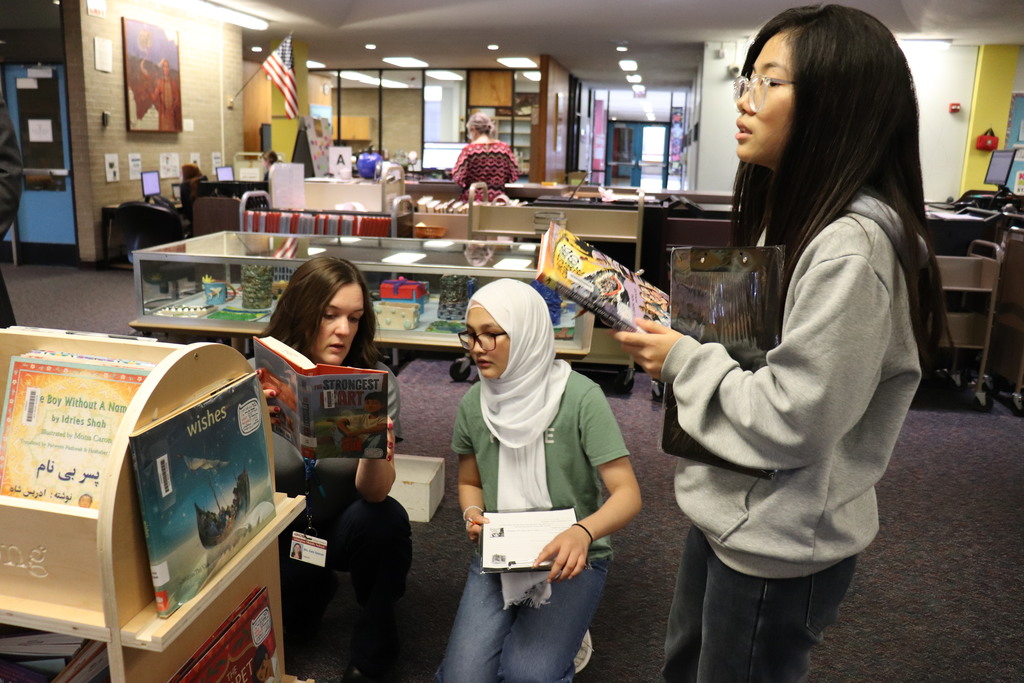 Students and teachers work on the activity together