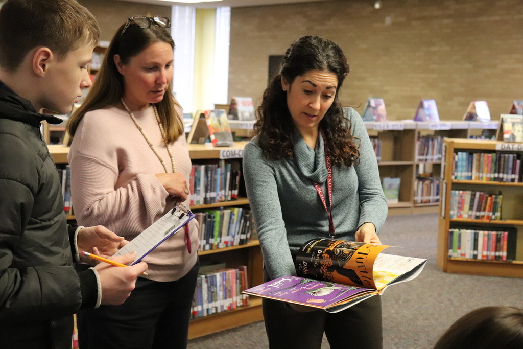 Students and teachers work on the activity together