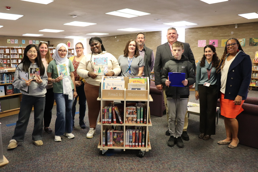 Students and staff pose with the library
