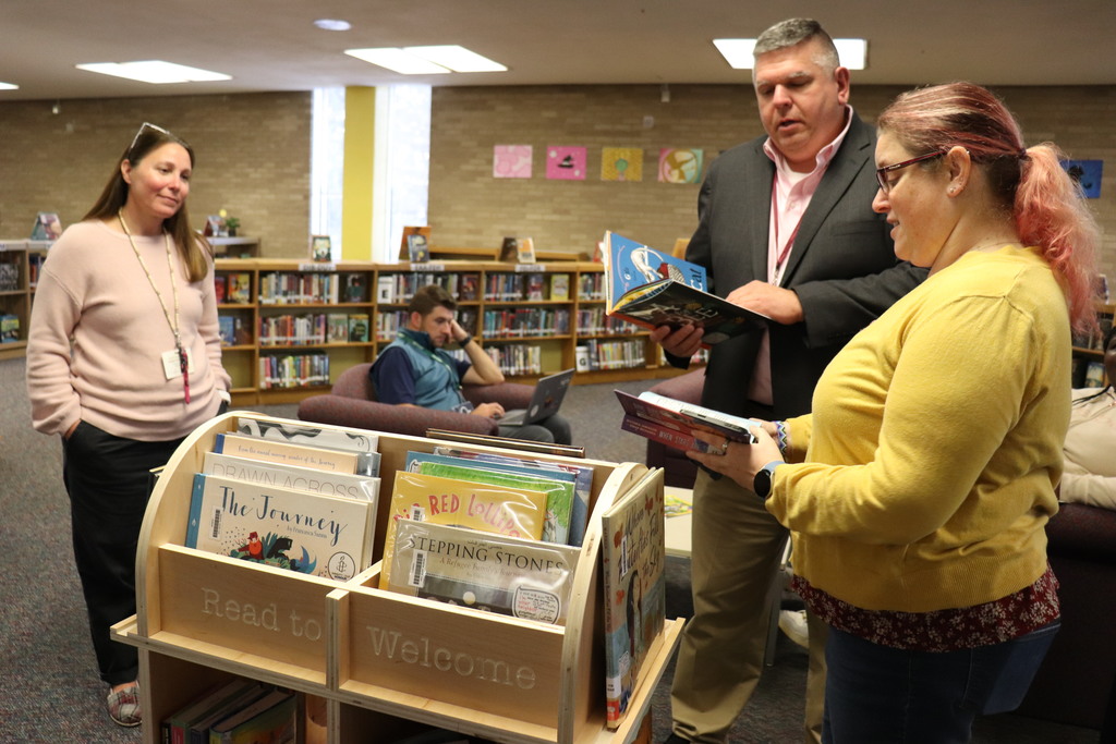 Staff review the books