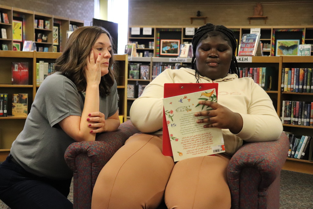 Students and teachers work on the activity together