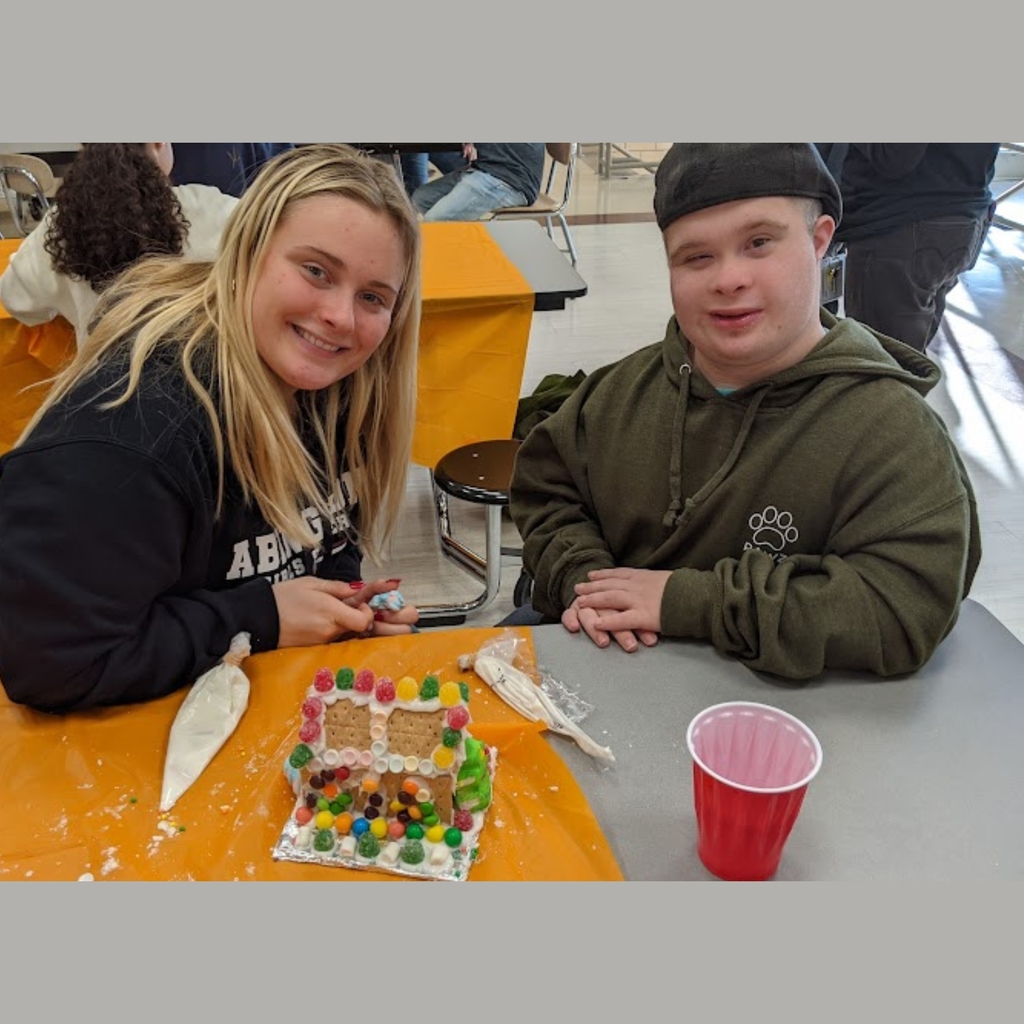 students working on gingerbread house