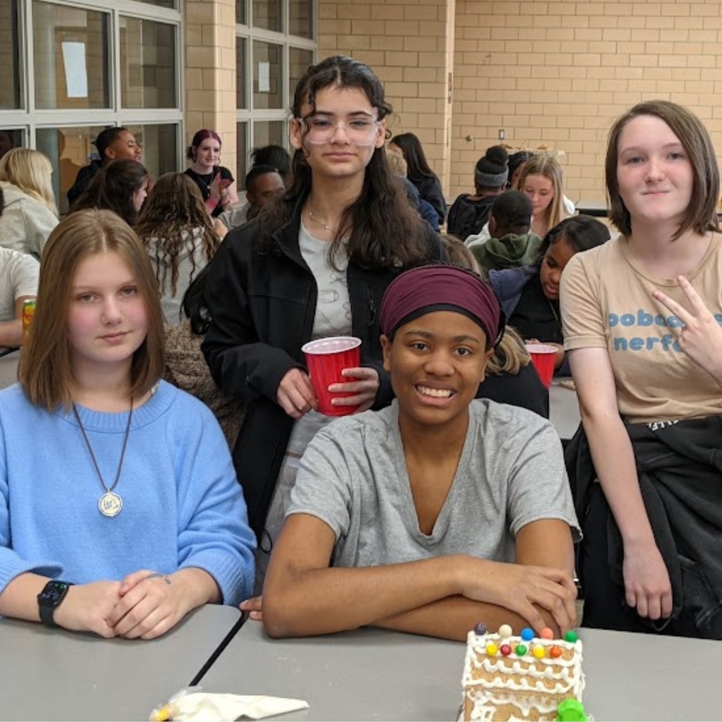 students working on gingerbread house
