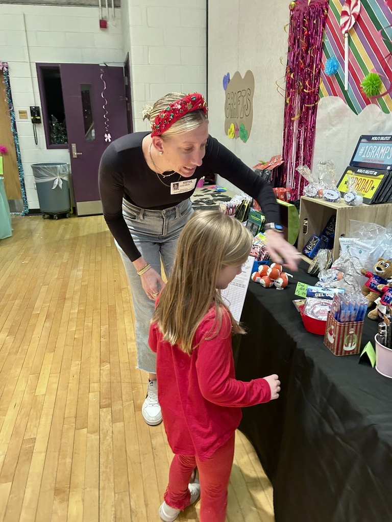 a volunteer helping a student shop