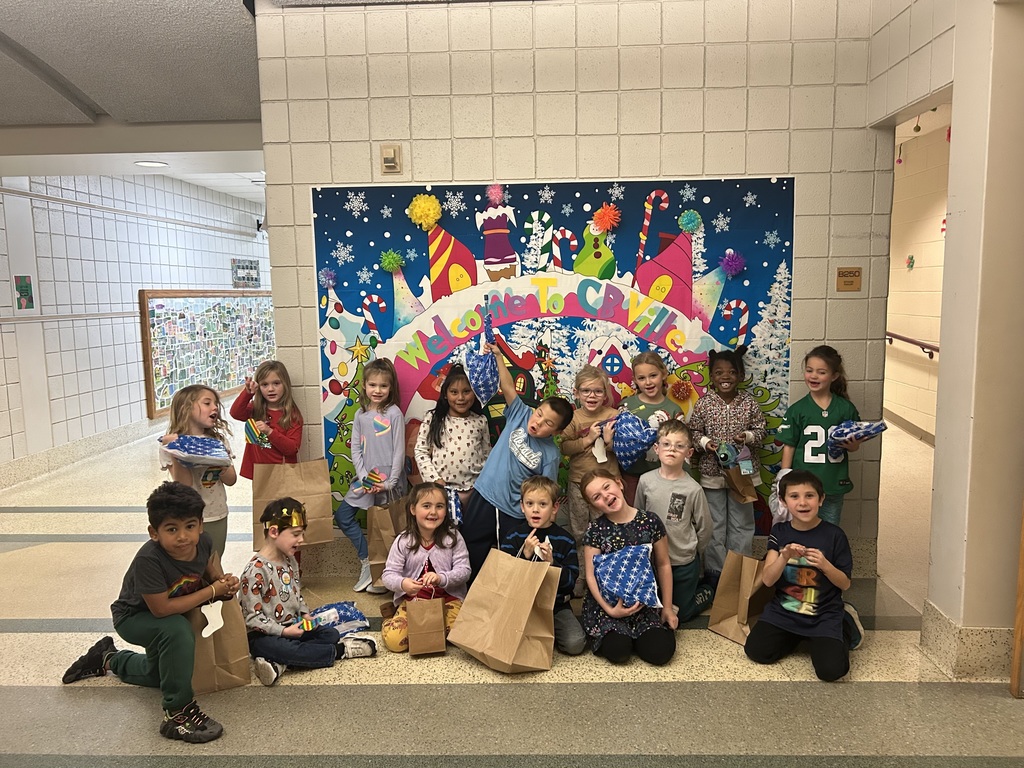 Students smiling at the holiday shop