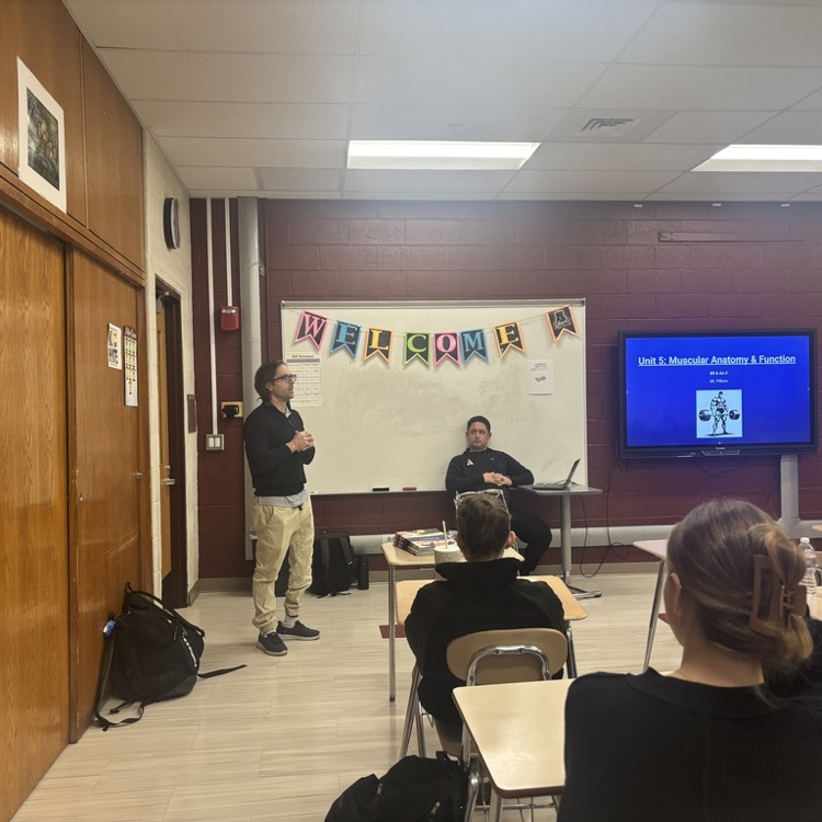 Mr Pollen instructs students 