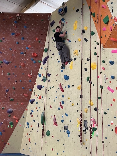 student climbing