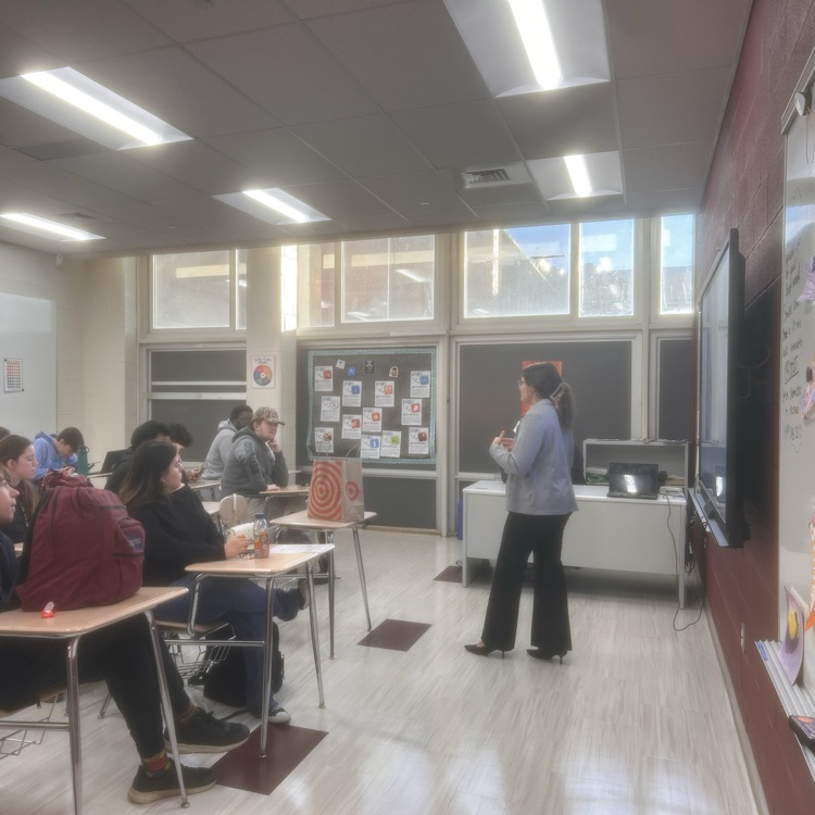 presenter talking to students