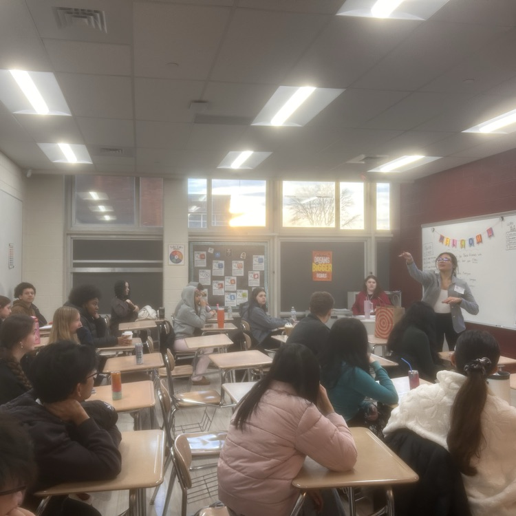 presenter calling on student for a Q and A