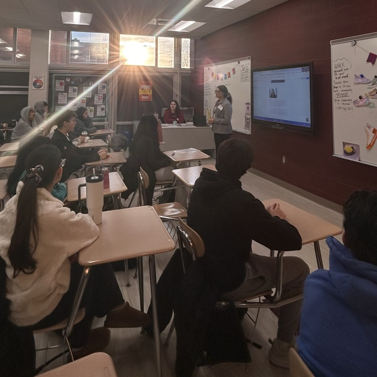 classroom presentation with sunrise through window