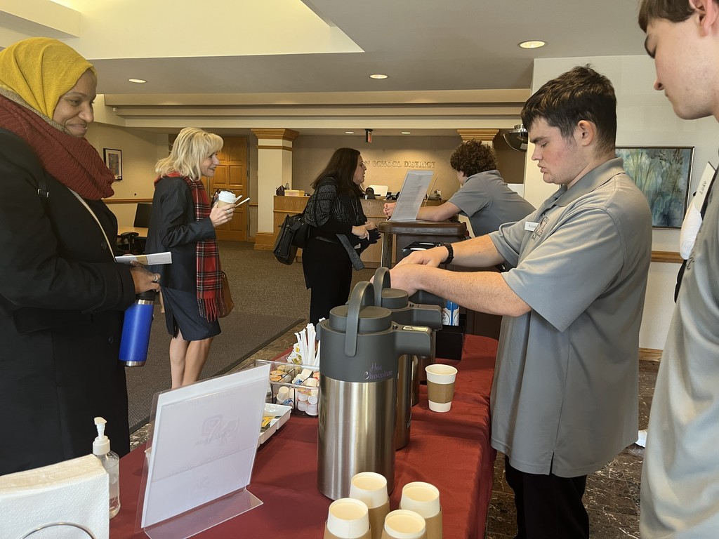 ACTIVE students make coffee for the guests as they arrive
