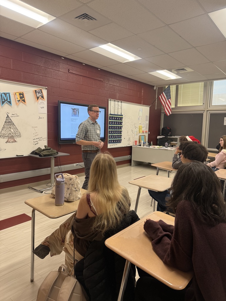 Dr. Eckenrode speaking with students
