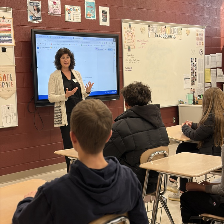 Joy speaking to class 