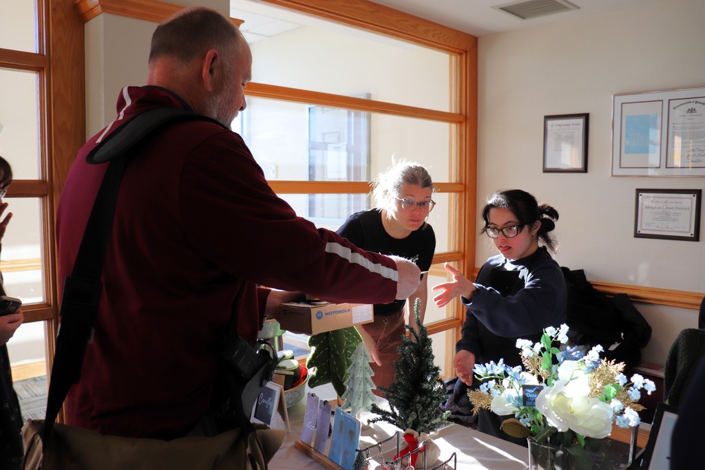 Administration building employees shop at the ACTIVE/STRIVE holiday pop-up. 