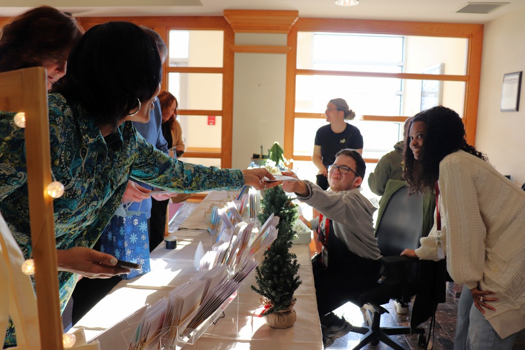 Administration building employees shop at the ACTIVE/STRIVE holiday pop-up. 